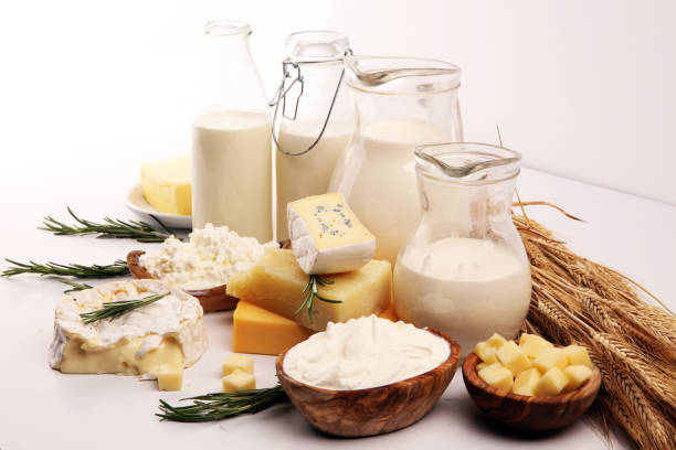 istock Different  healthy dairy products on rustic background with milk, cheese, butter and cottage 1185458237