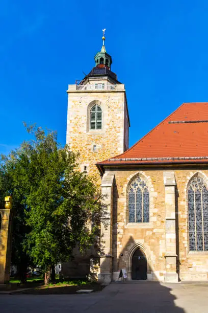 Germany, Ancient beautiful stone church building of city church called martinskirche in downtown kirchheim under blue sky on sunny day