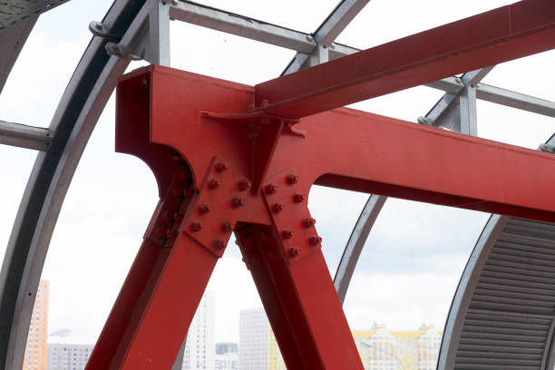 istock Steel connection of two red beams on bolts. Angular connection of vertical and horizontal channel. 1185459997