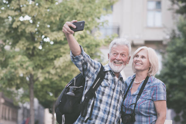 istock Senior couple taking selfie. Tourists taking a selfie 1185460355