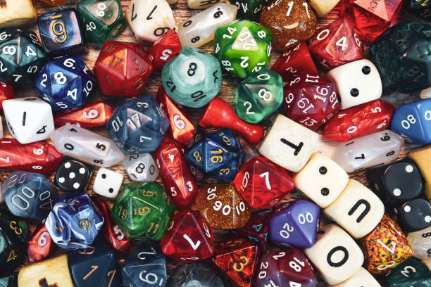 istock High angle view background with different colorful role playing dices 1185461577