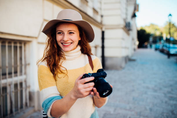 istock Female tourist exploring and photographing 1185461643