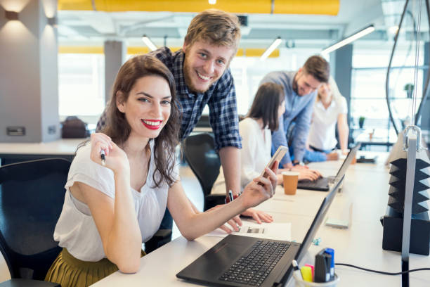 istock Young coworkers in modern office 1185462479