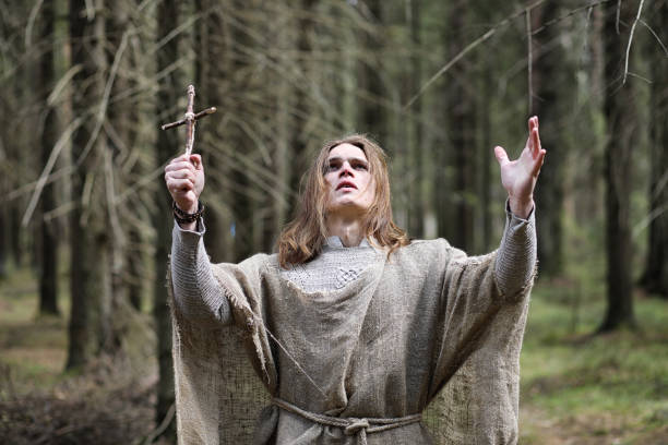 istock A man in a cassock spends a ritual in a dark forest 1185462612