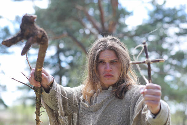 istock A man in a cassock spends a ritual in a dark forest 1185462743