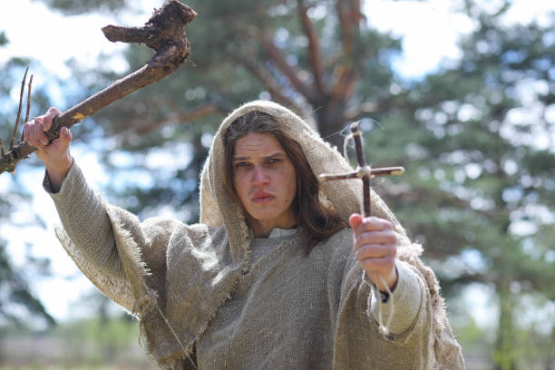 istock A man in a cassock spends a ritual in a dark forest 1185462768