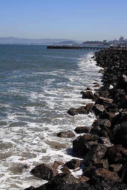 Beach Rocks Leading to a Pier in San Francisco stock photo