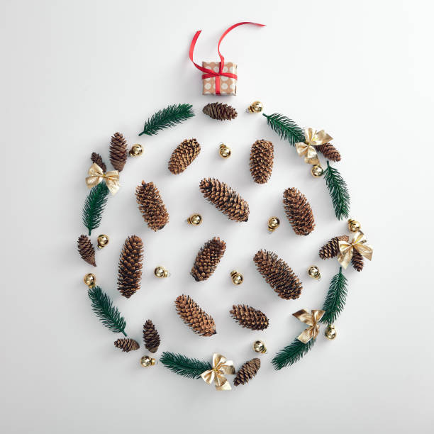 christmas wreath made from tree branch, pine cone and xmas bauble - sillhoutte imagens e fotografias de stock