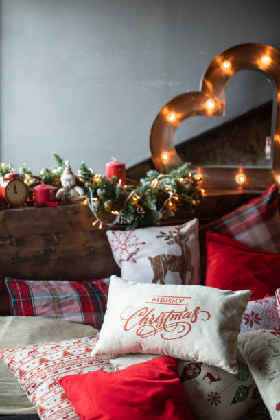 istock Cozy bed with Christmas pillows decorated with Christmas decor 1185464266