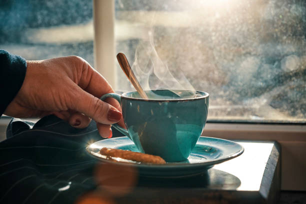 istock Cup of Black Tea Served with Biscuits 1185464400
