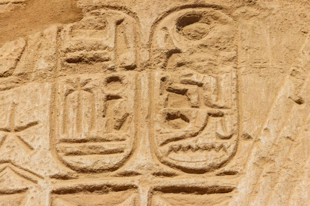istock Ancient egyptian hieroglyphs on the wall in Karnak Temple Complex in Luxor, Egypt 1185465087