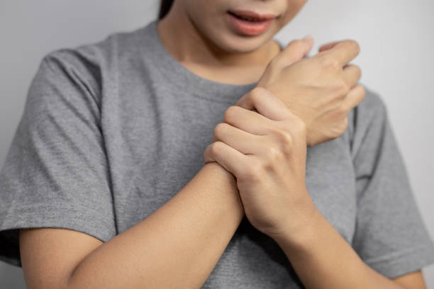 istock Woman suffering from pain in wrist. 1185465178