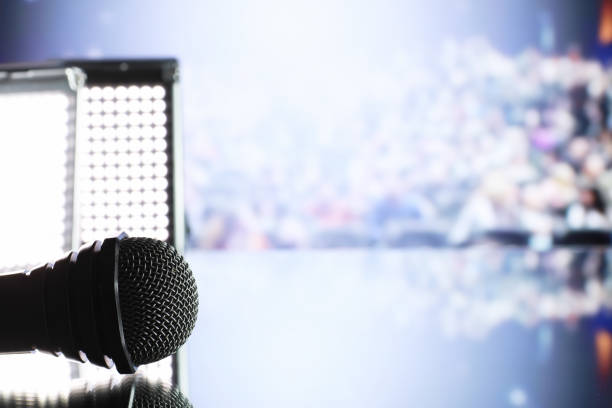 istock The microphone on the stage in front of the hall. Performance on stage. 1185465364