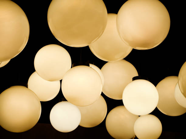 istock Lighting ball hanging from the ceiling on the black background. 1185467220