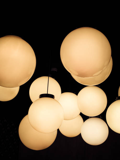 istock Lighting ball hanging from the ceiling on the black background. 1185467249