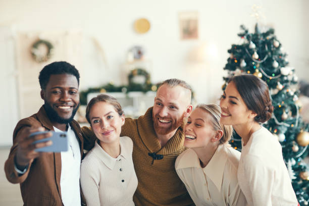 istock Friends Taking Selfie at Christmas Party 1185468239