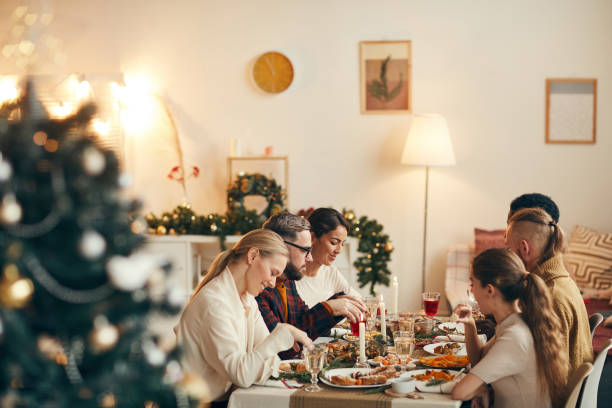 People Enjoying Christmas Dinner in Elegant Interior