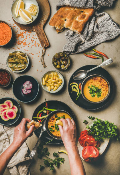 istock Turkish traditional lentil soup Mercimek and hands adding lemon juice 1185469027