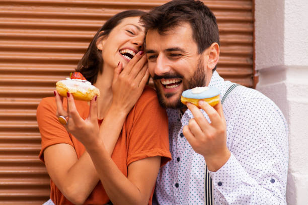 Woman telling secrets to her boyfriend.