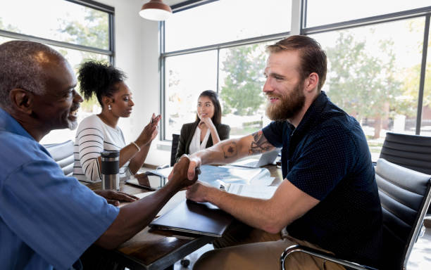 istock Confident businessman greets colleague with firm handshake 1185469433