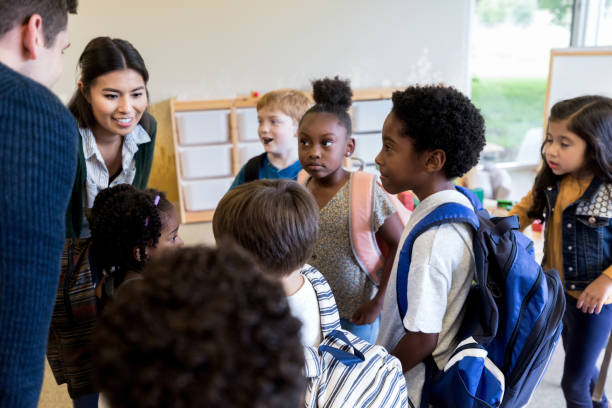 istock Attentive students listen to teacher 1185470195