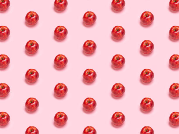 istock Colorful fruit pattern of fresh red apples. Isometric perspective, pattern on a blue background. Flat lay. Vegetarian eating concept. cheerful, spring, postcard, wallpaper, wrapping paper, Jonagold 1185470413