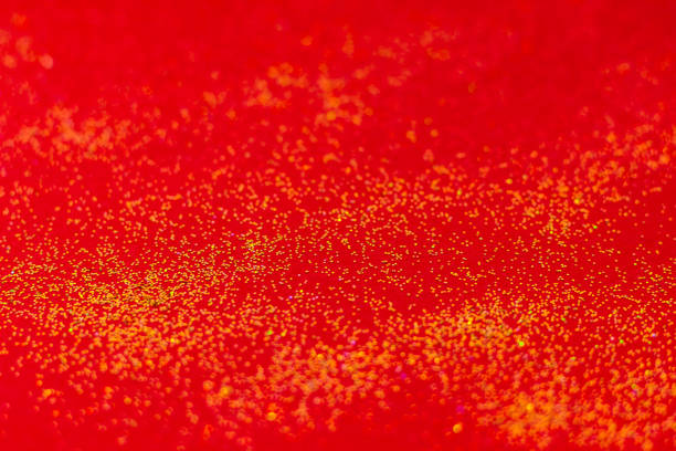 istock Golden sparkles on red background. 1185470616