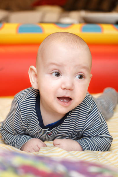 istock Baby boy trying to crawl 1185471817