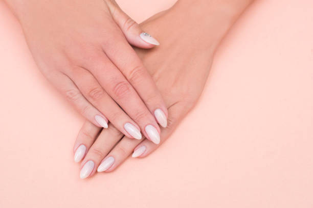 istock Beautiful stylish female manicure on a pink background. 1185471934