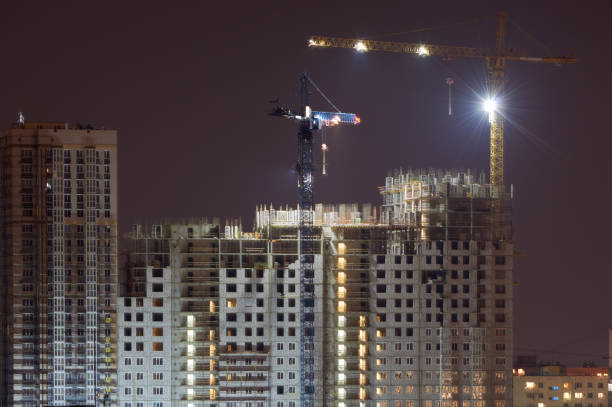 istock High-rise building under construction in the dark 1185474283