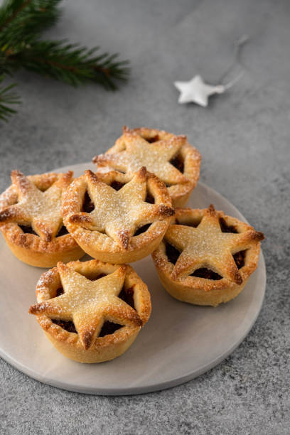 istock Delicious fruit mince tarts for Christmas dinner. Grey background, selective focus 1185474775