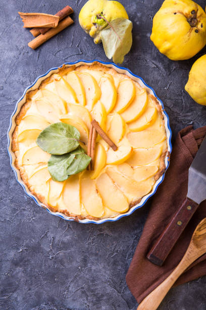 istock quince tart with custard open and shortcrust pastry and cinnamon. 1185476011