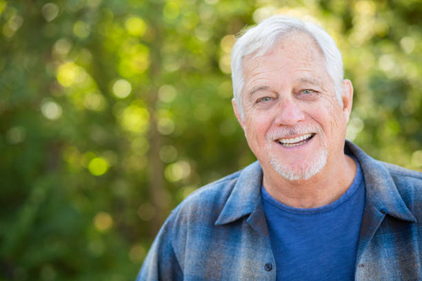 istock Happy senior man smiling 1185479606