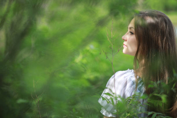 A girl in a spring green park on a walk