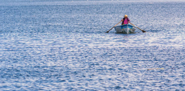 Lake Placid, USA - July 6, 2024. People enjoying water sports on Mirror Lake in Summer, Lake Placid, New York, USA