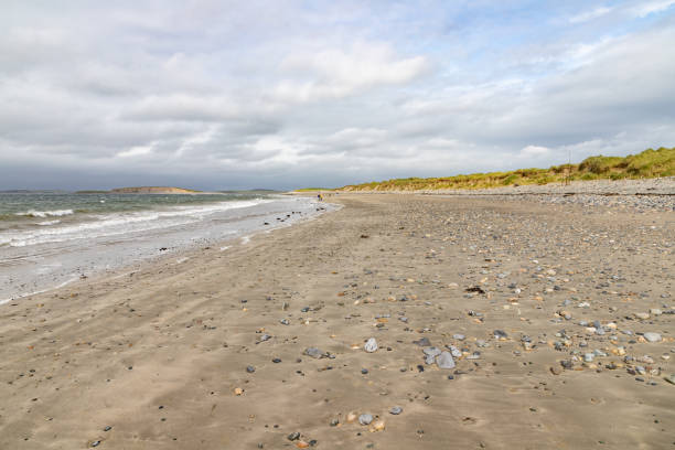 istock Waves and rocks at Bertra beach in cloudy day 1185484908