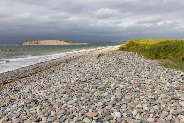 istock Waves and rocks at Bertra beach in cloudy day 1185485496