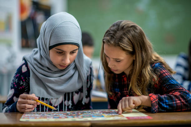 istock Multi-Ethnic Elementary Girls Studying in Class stock photo 1185489577