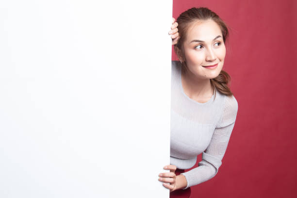 istock Young Asian woman with blank sign. 1185490126
