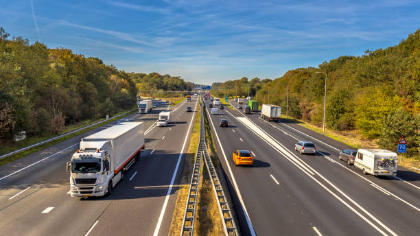 Afternoon Traffic seen from Above Afternoon motor Traffic on the A12 Motorway seen from above. This is one of the Bussiest highways in the Netherlands personal land vehicle stock pictures, royalty-free photos & images