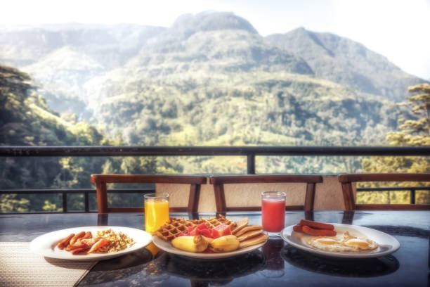 istock Breakfast in restaurant with beautiful view on mountains range in summer sunny morning during travel holidays 1185491319