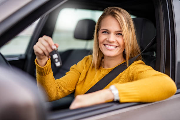 new driver in town! - car test drive car rental women imagens e fotografias de stock