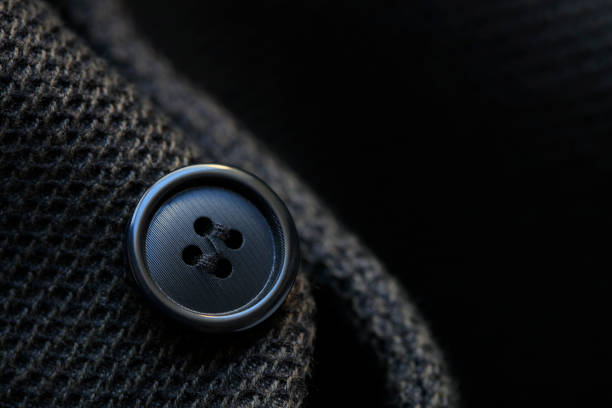 Dark wool coat with one black button Dark wool coat with one black button coat wool button clothing stock pictures, royalty-free photos & images