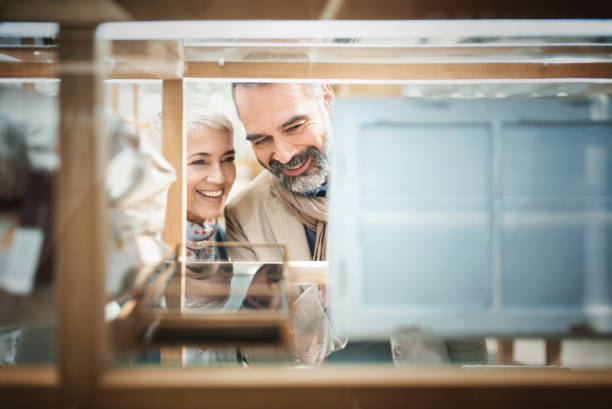 istock Mid aged couple in a shopping mall. 1185494544