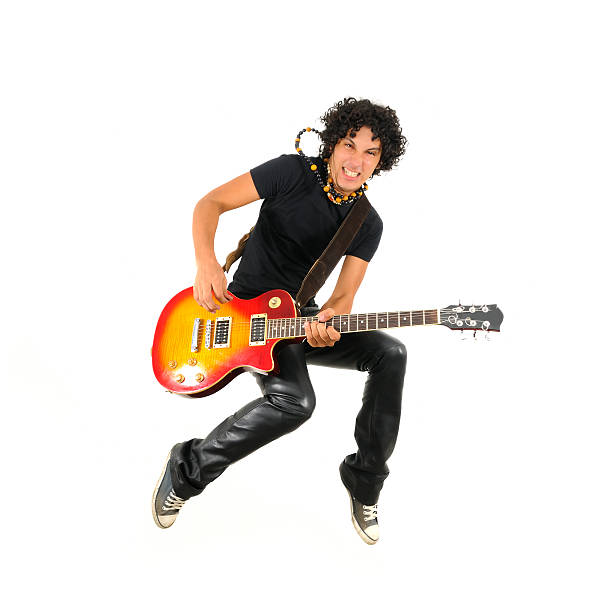 Young guitarist jumping isolated  guitarist photos stock pictures, royalty-free photos & images