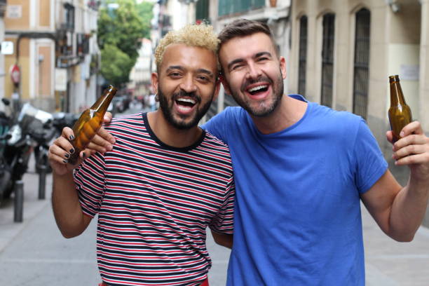 istock Two friends enjoying a beer 1185495539