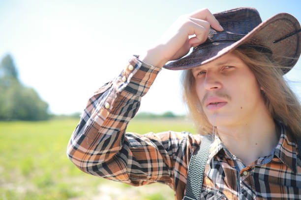 istock A man with a guitar on summer day outdoors 1185495698