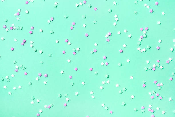 istock Little stars confetti on mint background 1185495989