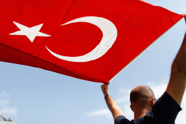 istock Man with Turkish flag rear shot 1185499324