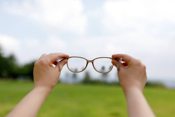 Woman hand holding eyeglasses
